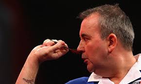 Photograph: John Gichigi/Getty Images. Phil Taylor was in impressive form as he beat Peter Wright 4-1 to book a place in the quarter-finals of the PDC World ... - Phil-Taylor-World-Darts-C-007
