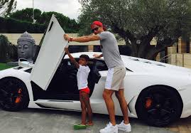 Image result for PIC OF RONALDO WITH HIS SON/MESSI WITH HIS SON