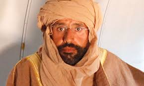 Saif al-Islam Gaddafi is pictured sitting in a plane in Zintan after his capture in Libya&#39;s rugged desert. Photograph: Ismail Zitouni/Reuters - Saif-al-Islam-Gaddafi-007