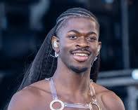 Lil Nas X wearing a daring Versace ensemble at the 2023 BET Hip Hop Awards