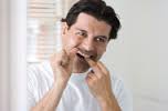 #29907576; Man using <b>dental floss</b>; IS_ImageSource; Downloads: 1 - stock-photo-29907576-man-using-dental-floss