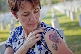 The Next of Kin pin (right) signifies a service-related death or suicide during active duty other than... Donna Engeman, Survivor Outreach Services program ... - size0