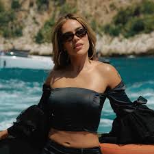 Karol G shows her abs while soaking up the Formula 1 atmosphere in Monaco