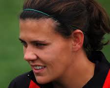 young Christine Sinclair playing soccer