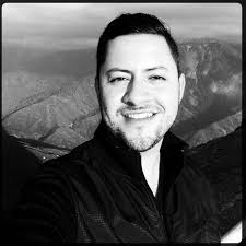 Mario Estrada takes a black and white selfie in front of a canyon backdrop. Name: Mario Estrada. Title: Editorial Director @ Snap Magazine // Director of ... - Mario_Estrada_selfie