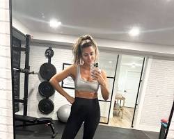 Image of woman in her early 30s, dressed in workout clothes