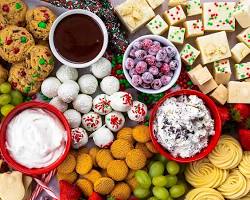 Immagine di variety of chocolate products, including truffles, bars, and cakes, displayed on a beautiful table