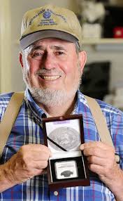 Thomas Donlon holds up a case holding the 1800 George Washington funeral medallion that he bought on eBay and recently had authenticated. - gwfuneralmedal%2B1%2Bcopy11-630x1024