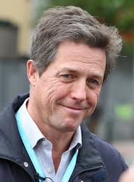 Hugh Grant is a &quot;big pain in the a**.&quot; That&#39;s what Jon Stewart told a crowd during an onstage fundraiser with Comedy Central cohort Stephen Colbert. - hugh-grant-closeup