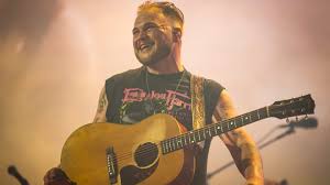Country singer Gavin Adcock calls out Zach Bryan, who scaled fence to fight him