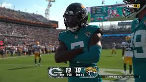 Jaguars' Trevor Lawrence finds Brian Thomas Jr. for a touchdown, taking the 
lead over the Packers