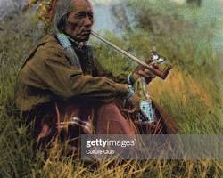 Image of Native American smoking a pipe