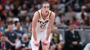 Caitlin Clark takes a hit during a WNBA game