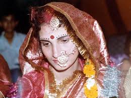 Bindu Sharma fully adorned with tika (forehead ornament), nath (nose ring), and face decoration, 1989. Photograph courtesy of Satya Kam and Bindu Sharma - TPO_PNZ099o800_WM