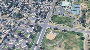 Man dies after speeding driver runs red light, crashes into him, Aurora police say