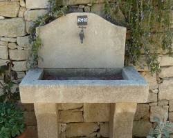 Hình ảnh về natural stone lavabo in a garden setting