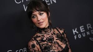 Dakota Johnson Dazzles in Sheer Black Gucci Tulle Gown at Kering Foundation Gala in NYC