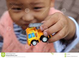 Your download plan was renewed. Congratulations and thank you for your business. Read more | Payment Profiles &middot; A boy holding a toy fire truck. - boy-holding-toy-fire-truck-5146432