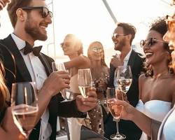 Image of sophisticated group champagne toast on yacht