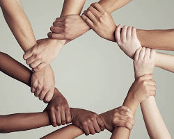 Image of group of people joining hands