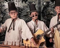 performance of Korean Court Music – musicians in formal attire playing traditional instruments in a stately setting 이미지