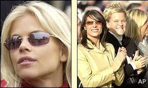 Elin Nordegren watches Tiger Woods while Suzanne Torrance applauds with Pernilla Bjorn. While the players tackle the redesigned course their other halves ... - _38280378_applause_splitap