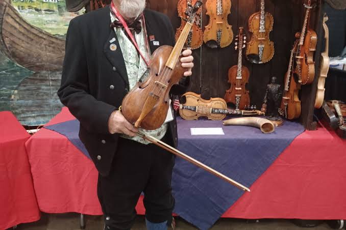 Sons of Norway to host free Bud Larsen fiddle concert Aug. 23 at Calvary Lutheran Church; fiddles feature rostegning ink-on-wood art