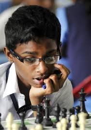 ... Guru Vignesh lost in thought at the Velammal 2nd National School Chess Championship. - LAT_NATIONAL_SCHOO_1487919g