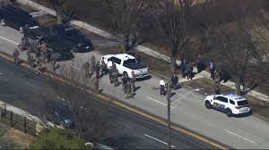 Baltimore police say an officer and suspect have been shot in an ‘active shooter incident'