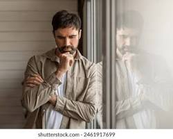 Image of person alone in a minimalist quiet room with soft light looking at window digital silence peace versus anxiety concept photo reference