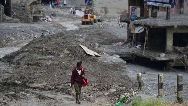 Rescuers race to reach workers trapped in hydropower tunnels as Nepal flood death toll rises; at least 500 of 900 missing feared inside