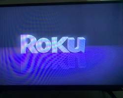 Image of TV screen showing the Roku logo