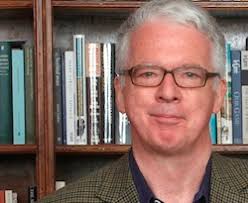 Peter Stothard - peter-stothard-smiling-in-front-of-bookcase