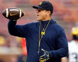 Image of Jim Harbaugh coaching college football and NFL football