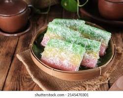 Gambar Lenjongan, a colorful assortment of traditional Indonesian cakes made from rice flour, coconut, and sugar.