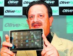 Olive Telecommunications India chairman Arun Khanna displays the 3G tablet Olive pad at its launch in Mumbai, July 22 - biz2