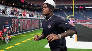 Tank Dell warming up on the field before a Houston Texans game