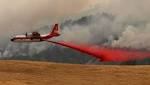 A forecast of record-breaking heat and dry wind sparks brush fire worries across the state