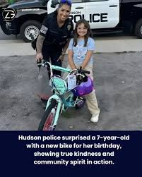 Hudson police officers were responding to a call on Cedar St. when a 7-year-old girl approached them asking for help with her bike. The officers tried their best to fix it, but