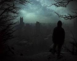 Image of silhouette of a person standing alone in a dark forest