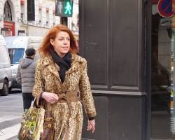 Image of Parisian woman wearing leopard print coat