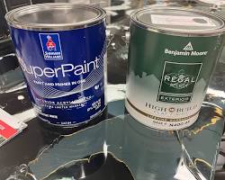 Image of paint cans from Benjamin Moore, SherwinWilliams, and ECOS Paints