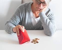 Image of elderly European citizens looking concerned about money