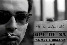 A still frame from Jacques Rivette&#39;s film Paris Belongs to Us shows Jean-Luc Godard as he holds a newspaper where he wrote “Tu es adorable” (You are ... - RIVETTE_Paris_Nous_Appartient_1961