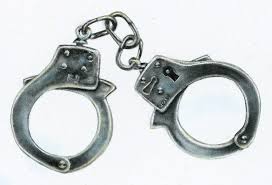 Image result for Nik Nazmi Nik Ahmad, in prison clothes and being led by the police in handcuffs