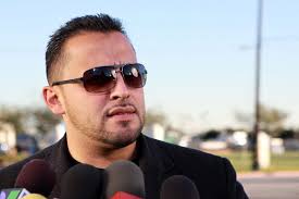 Singer <b>Juan Rivera</b> speaks outside All Souls Cemetery on December 20. - 158608492-singer-juan-rivera-speaks-outside-all-souls-gettyimages