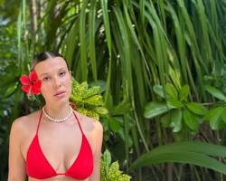 Millie Bobby Brown in red one-piece swimsuit