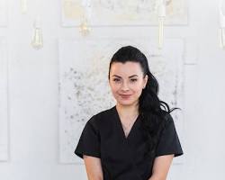 Image of Massage therapy: A photo of a massage therapist performing a back massage on a client