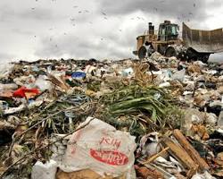 Bildmotiv: landfill overflowing with clothes