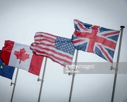 flags of the United States, the European Union, and Canada